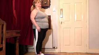 Fat lady showing off her body during a yoga workout