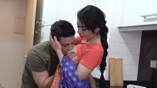 Busty Indian wife filmed in the kitchen preparing for a smashing fuck