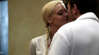 A blonde with a sexy short skirt is fucked on the bed