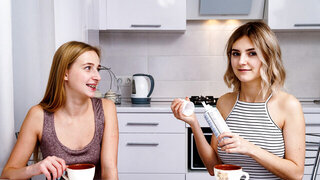 Two European blondes end up fucking each other on a couch