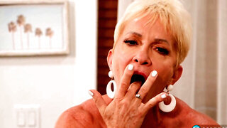 Sixty-two slut Jean Lo showing her fingering skills