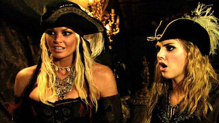 Two sexy pirate chicks are in a threesome, handling a cock