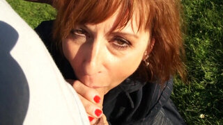 Mature redhead gives head in public and likes being taped
