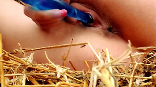 Cute brunette with a shaved pusssy masturbates in the hay