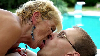 Nasty old blonde that loves cock is getting fucked by the pool