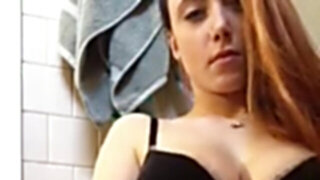 Camgirl in black bra masturbates in the bathroom