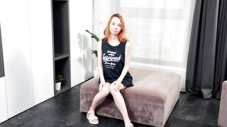 Redheaded beauty smiles, charms, and fucks her toy, too