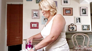 GILF bimbo Linetta is playing with her wet pussy