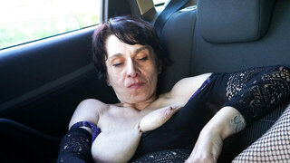 Busty brunette GILF putting on a solo show with a toy