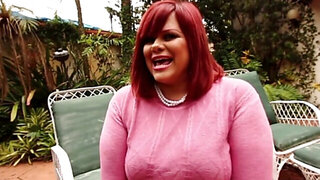 Chubby redhead Marcy Diamond taking on a black cock