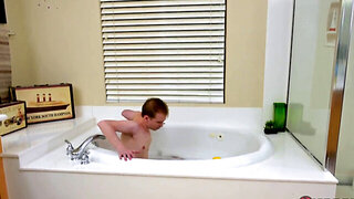 Bathtime for a skinny lad and his attractive stepmom
