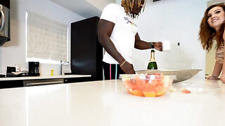 A black man receiving a sloppy blowjob in the kitchen