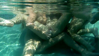 Underwater lesbian threesome with ladies in the pool