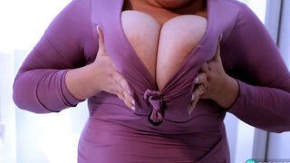 Blonde BBW with tattoos is squeezing her natural boobs