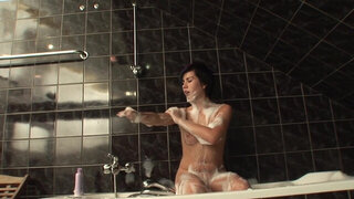 Brunette beauty shares soapy moments of raw pussy masturbation