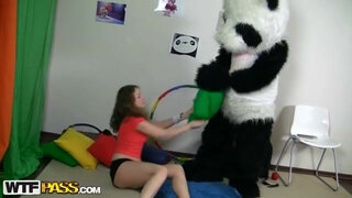 Titted brunette to have sex with huge toy panda