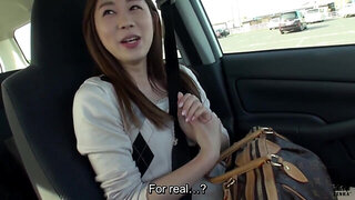 Appealing Japanese girl shows her wet pussy in a car