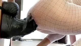 Horny whore takes giant dildo deep into her asshole