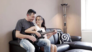 Guitar playing older guy gets to fuck a brunette babe