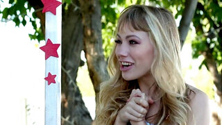 Lezzie blonde model fingers pussies by the kissing booth