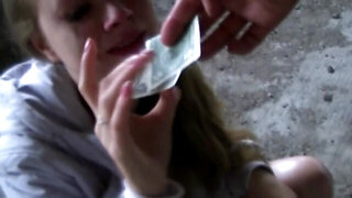 Petite babe Yulia Blondy deepthroats a large dong outdoors