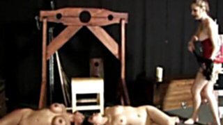 Domme taunts and disciplines slaves
