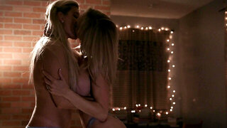 Two blonde babes are engaged in sensual lesbian intercourse