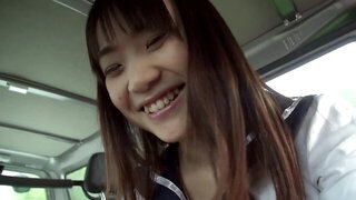 Asian shows tits off in the backseat and sucks driver's cock