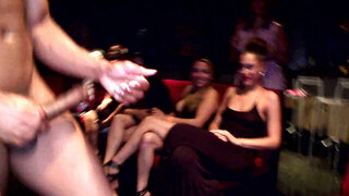 Crazy hot party girls sucking on hard stripper cock at the club