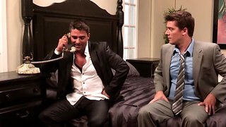 Young couple checks in a hotel and makes passionate love on bed