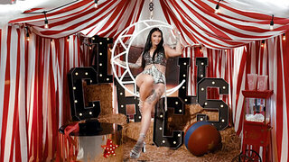 Hot brunette masturbates in one of the carnival tent