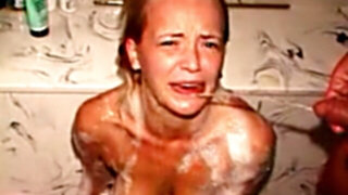 Girl on knees getting piss