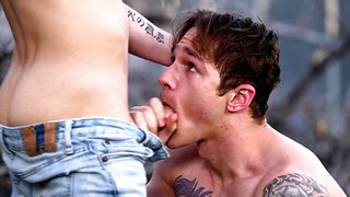 Tattooed dude and a nerdy lad banging in the woods