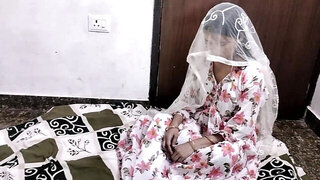 Wearing her wedding gown and having sex with her man