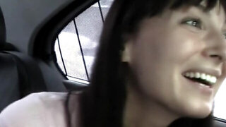 Brunette is getting cumshot in the mouth while in the back of a car