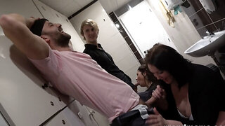 Two curvy brunettes share cock in a filthy bathroom suckfest