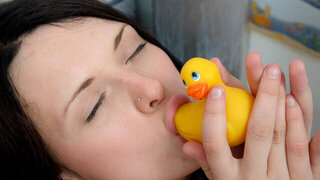 Thirsty teen spreads her pussy lips next to a rubber duck