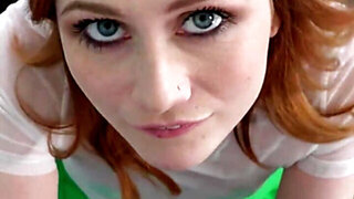 Redheaded beauty is going to seduce in see-through garb