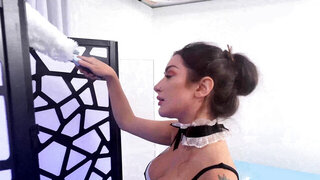Tattooed maid Bella Blu working on a big penis