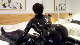 Two latex bodysuit fiends enjoying BDSM action