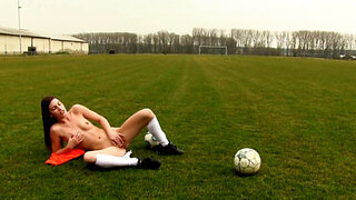 Zena Little sits on a soccer ball and fingers herself outside