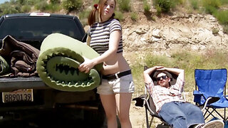 Redheaded camper slut takes on two guys by the tents
