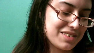 Solo girl in glasses playing with her hairy pussy