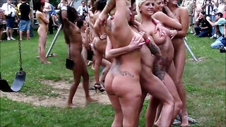 Naked chicks have a lot of fun during outdoor festival