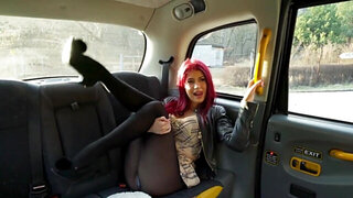 Thick redhead is getting schlonged in the fake taxi