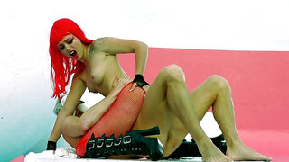 A redhead with tattoos is getting penetrated in her wet tight pussy