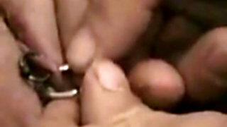 Pierced cunt slave getting more piercings