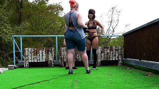 Two horny ladies are doing a fetish photoshoot outdoors