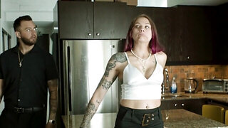 Inked babe and a tattooed stud are doing it in the kitchen