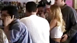 Embarrased chick undressed in crowded bar
